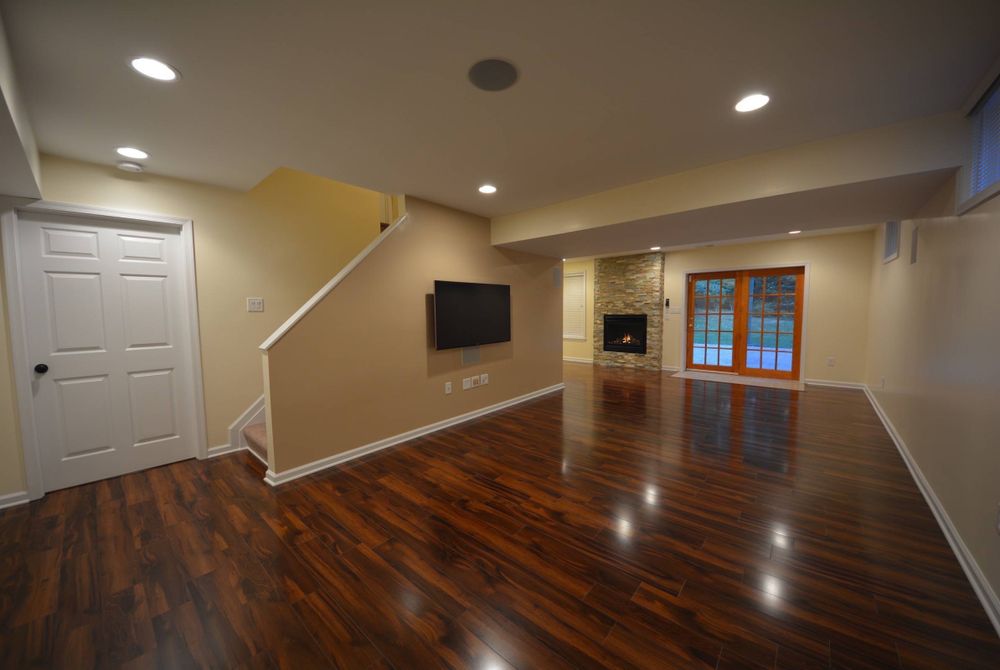 Shiny new laminate flooring for a basement remodeling project. Laminate floor retains its shine for many years without fading.