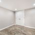 Renovated basement with a pet shower and tiled flooring